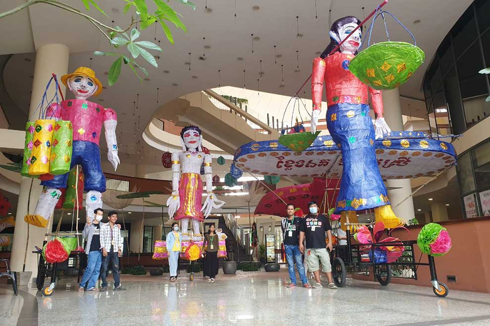 The giant puppets include palm juice seller (left), Citadel of Woman (middle) and nom banh chok seller (right), seen here on display at Siem Reap’s Heritage Walk. SUPPLIED