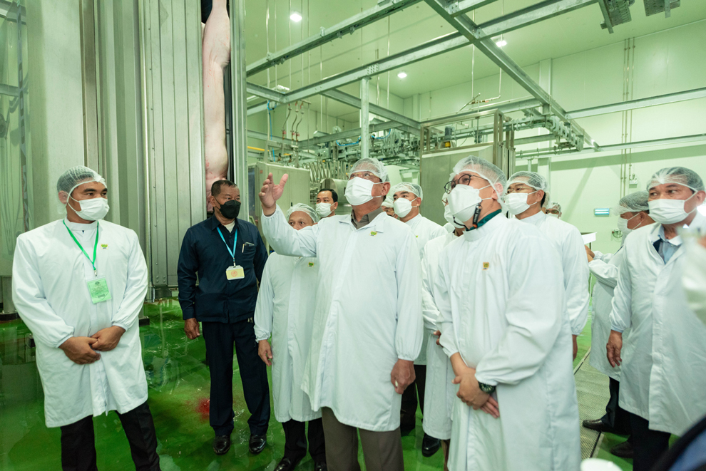 Sar Kheng is taken on an inspection of the factory. SUPPLIED