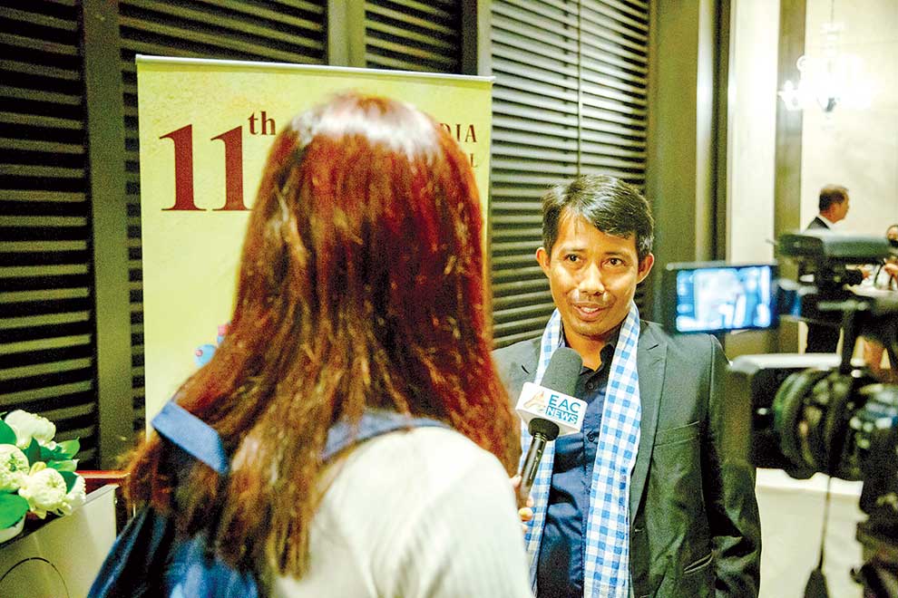 Sopheap Chea (right), director of Bophana Centre, gives an interview at the press conference on May 25 at Rosewood Phnom Penh. SUPPLIED