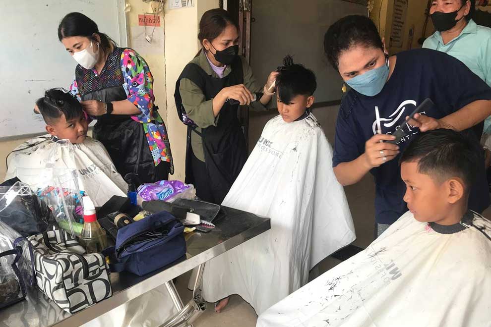 Students at the school getting free haircuts. SUPPLIED