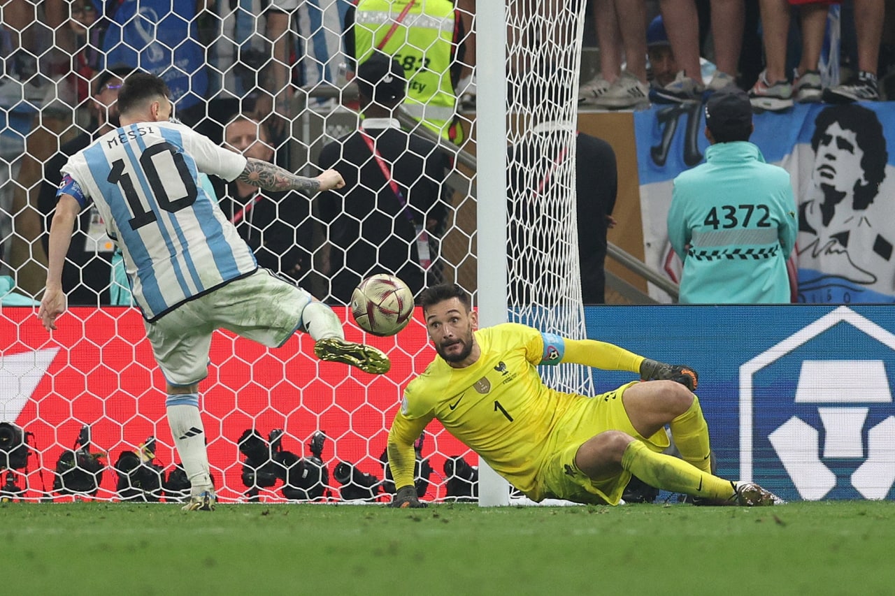 Messi scores his team's third goal past France's goalkeeper #01 Hugo Lloris. AFP