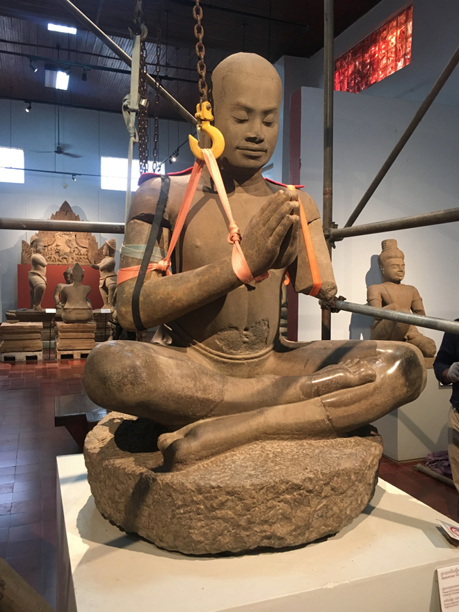 The arms of Jayavarman VII are hoisted back into place during the statue’s restoration. FRENCH EMBASSY