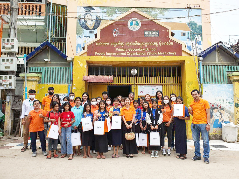 A volunteer FWD Cambodia team visits a school in Phnom Penh as part of its Community Care programme. PHOTO SUPPLIED