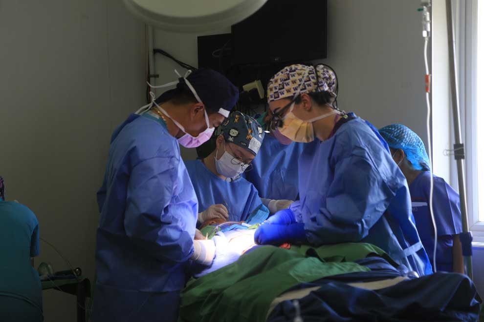 The volunteer doctors of Smile Cambodia’s Smile Centre operate on a child’s ears at the Khmer-Soviet Friendship Hospital on January 7.