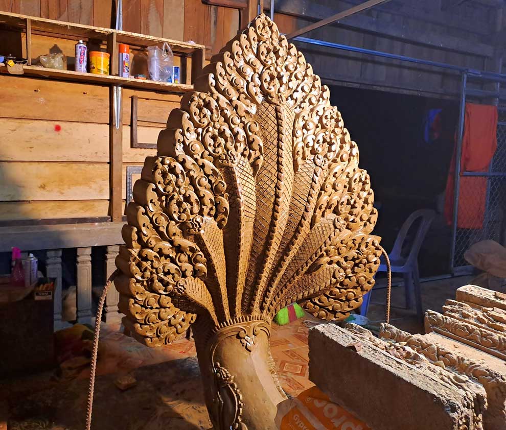 A seven-headed naga statue was sculpted by venerable Chhorn Ravuth in Kampong Cham province. Chhorn Ravuth, FB