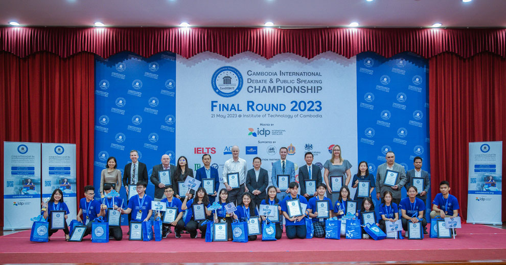 The 2023 CamDEBATE champions and finalists pose for a group photo with the judges. Supplied