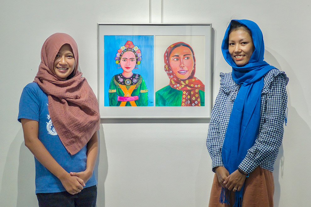 Kol Vicheka (left), co-producer of the VOICES exhibition, and Kaeu Sreypeou, the first Cham community member to graduate from the Royal University of Fine Arts. Sopheap Choun