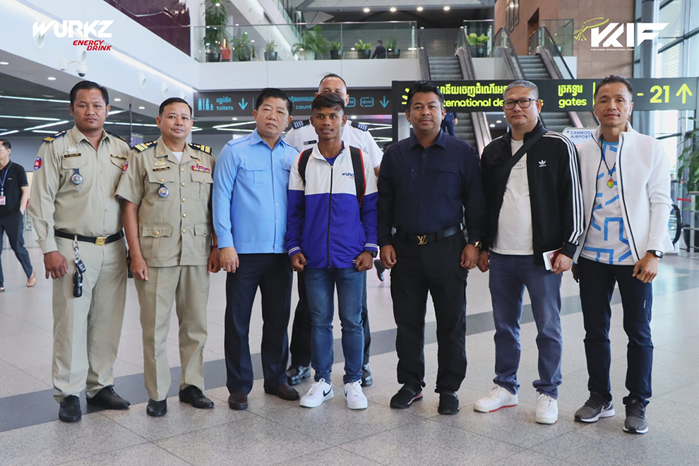 Kan Meng Hong and his delegation pose for a photograph at Phnom Penh International Airport, ahead of their departure for Japan on July 4. Supplied