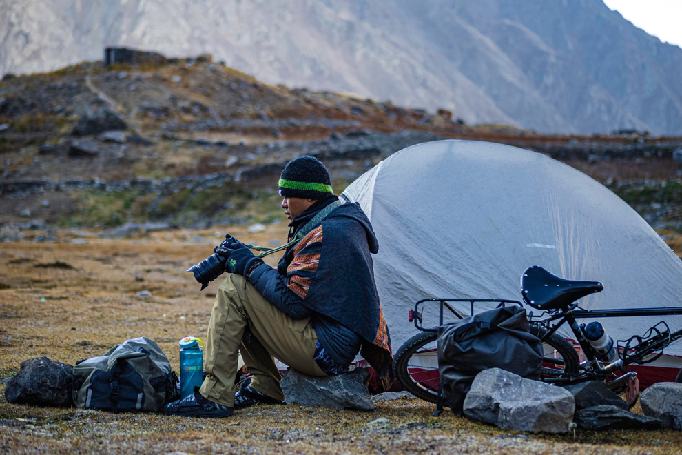 Tiv Dararith checks the day’s images while camping at Pangong Lake in India, a location for popular Indian feature film “3 Idiots”. Tiv Dararith