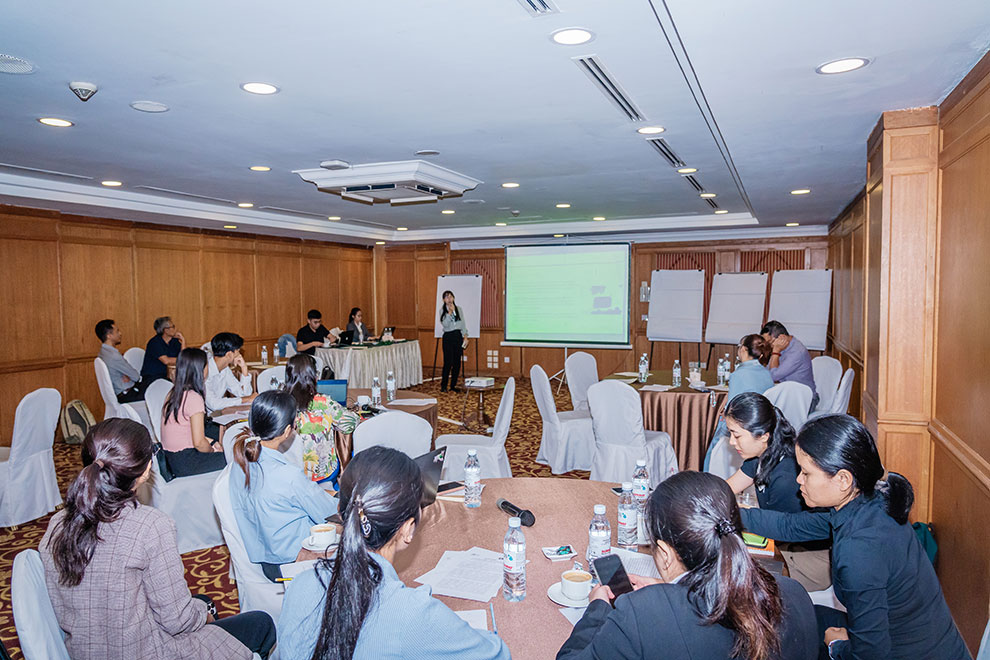 Vinh Socheata, an independent advisor and researcher, delivers a presentation at the January 27 forum. DMC