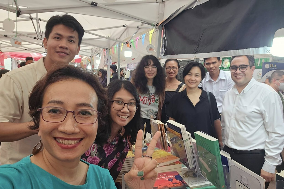 Author So Phina and supporters at a recent book fair. Supplied