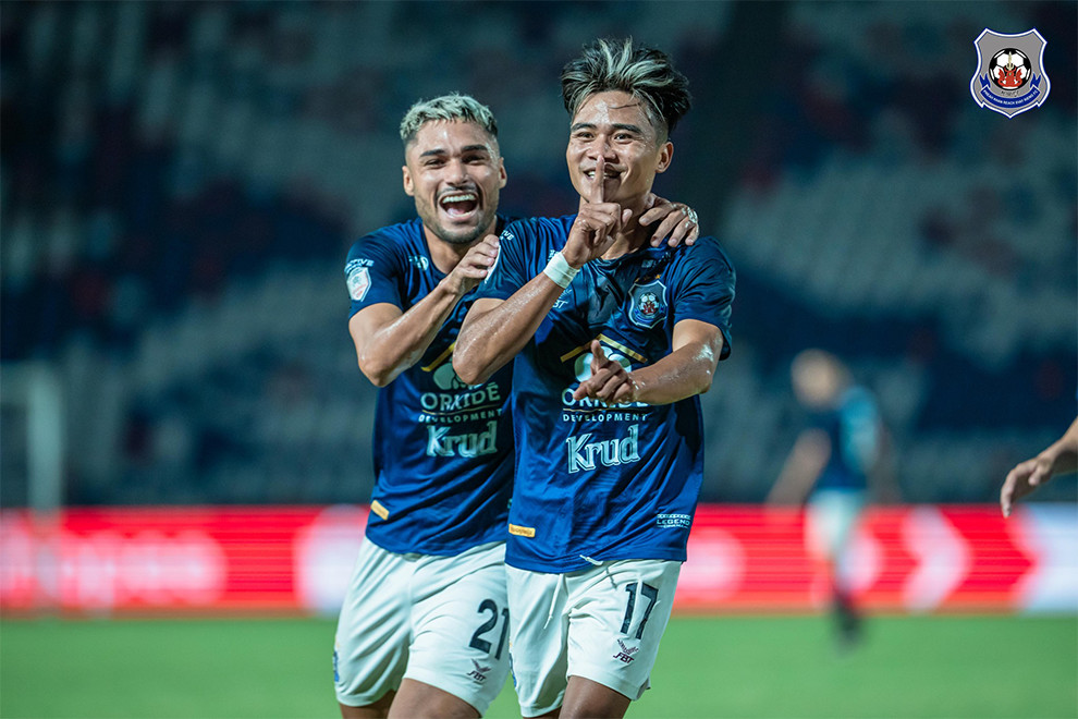 Laotian player Bounphachan Bounkong and Brazilian striker Christian Roque celebrate the second goal of the match. The two each scored twice for Svay Rieng. Svay Rieng FC