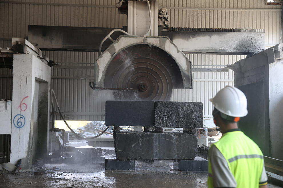 A worker monitors a marble saw in Kratie province’s Snuol. Hong Raksmey
