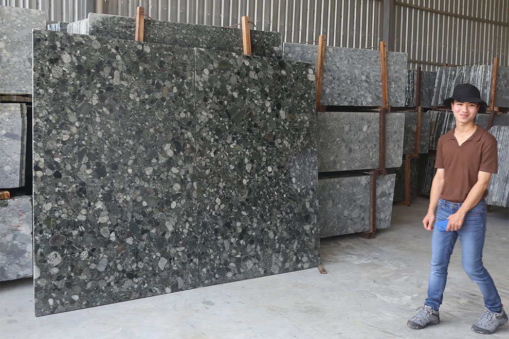 A large polished slab of granite is displayed at a factory in Svay Chhreah commune. Hong Raksmey