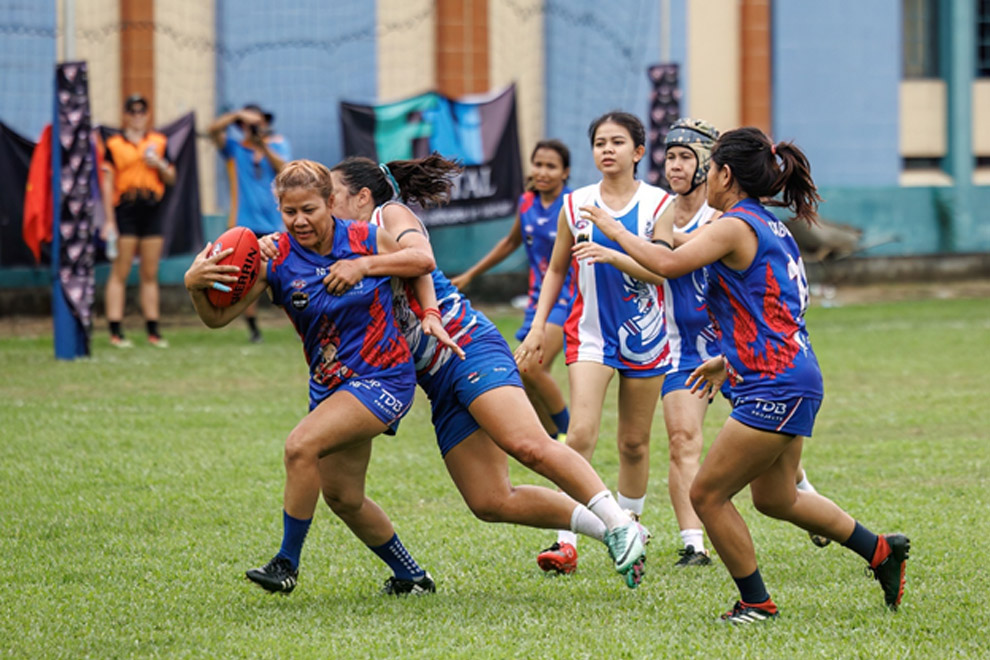Thida Doeur shrugs off defenders against Thailand at the 2024 AFL Asia Cup in Saigon in December. AFL Asia