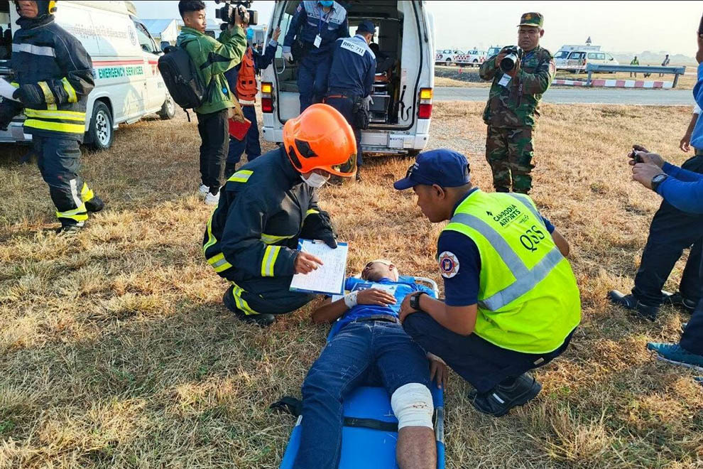 Emergency responders take part in the simulated rescue and treatment of plane crash victims at Phnom Penh International Airport. Information ministry