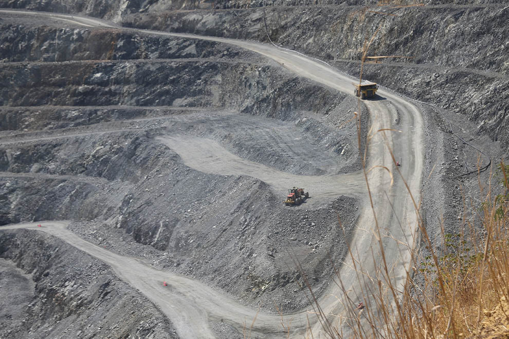 Giant dump trucks carry rock from the gold mine in the Okvau area of Mondulkiri province’s Keo Seima district. Hong Raksmey