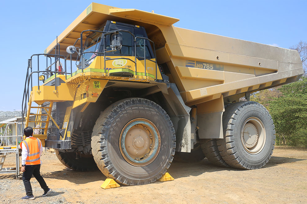 Each of the massive trucks can haul almost 100 tonnes of rock. Hong Raksmey