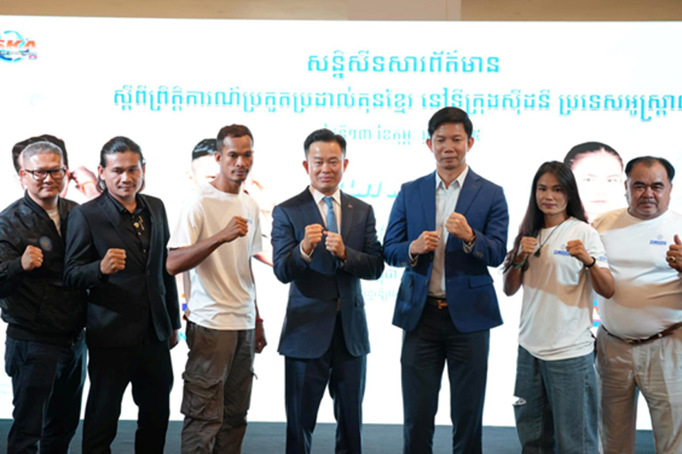 Puth Sambo and Sam Tharoth pose with their coaching staff during a february press conference. Supplied