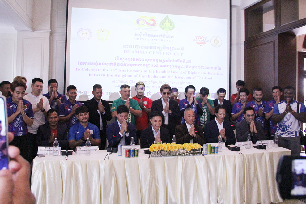 Representatives from Cambodia and Thailand raise their hands in Buddhist prayer during the February 24 press conference to announce the event. Chhorn Norn