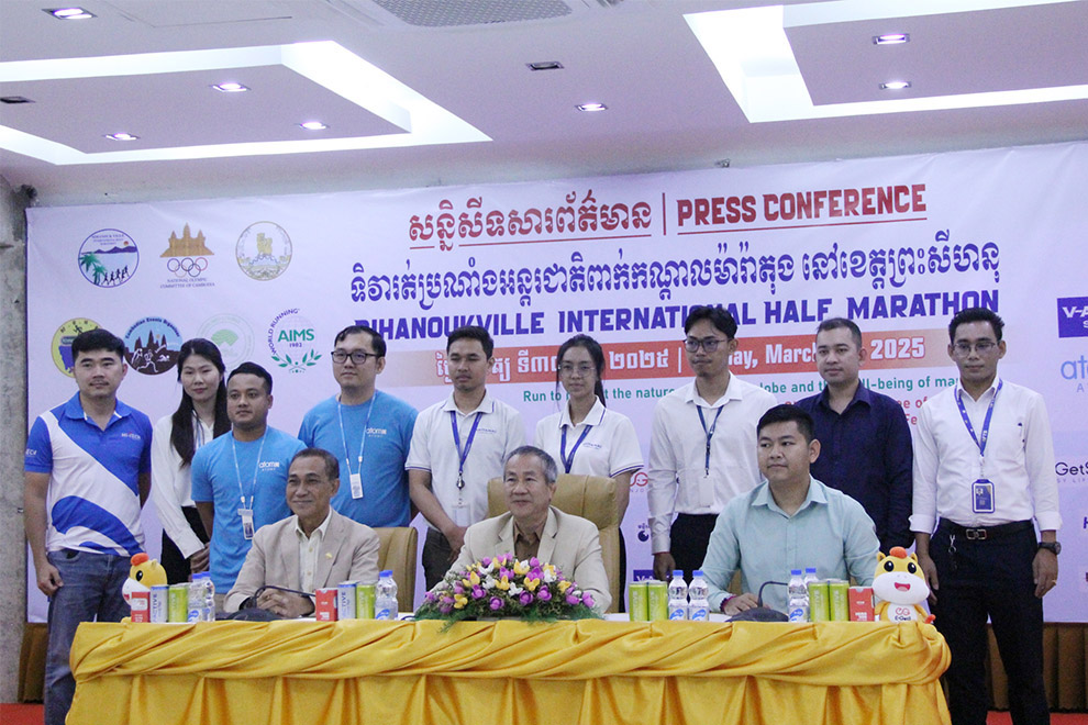 NOCC secretary-general Vath Chamroeun (centre) addresses a February 25 press conference on the upcoming event. Chhorn Norn
