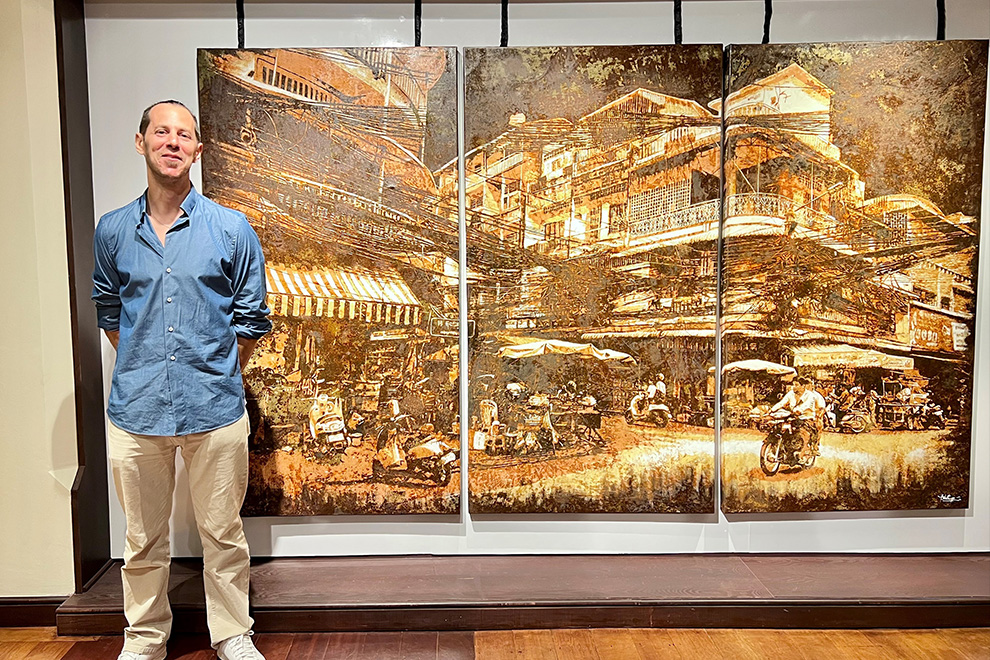 French artist Théo Vallier stands in front of one of his pieces. Post staff