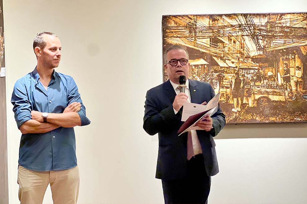 Artist Vallier and Charles-Henri Chevet, area general manager of Sofitel Phnom Penh Phokeethra, speak at the exhibition's opening. Post staff