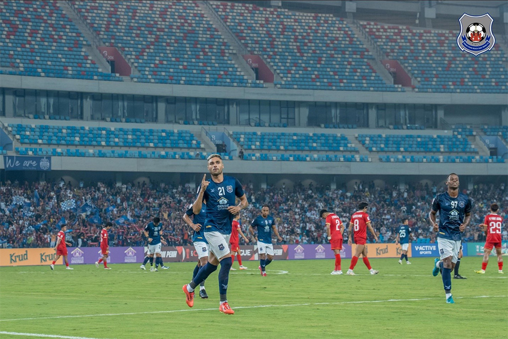 As Svay Rieng celebrate, Shan United’s Zwe Khat Min (number 2 jersey, in red) bows his head as he rues his 65th minute own goal. Svay Rieng FC
