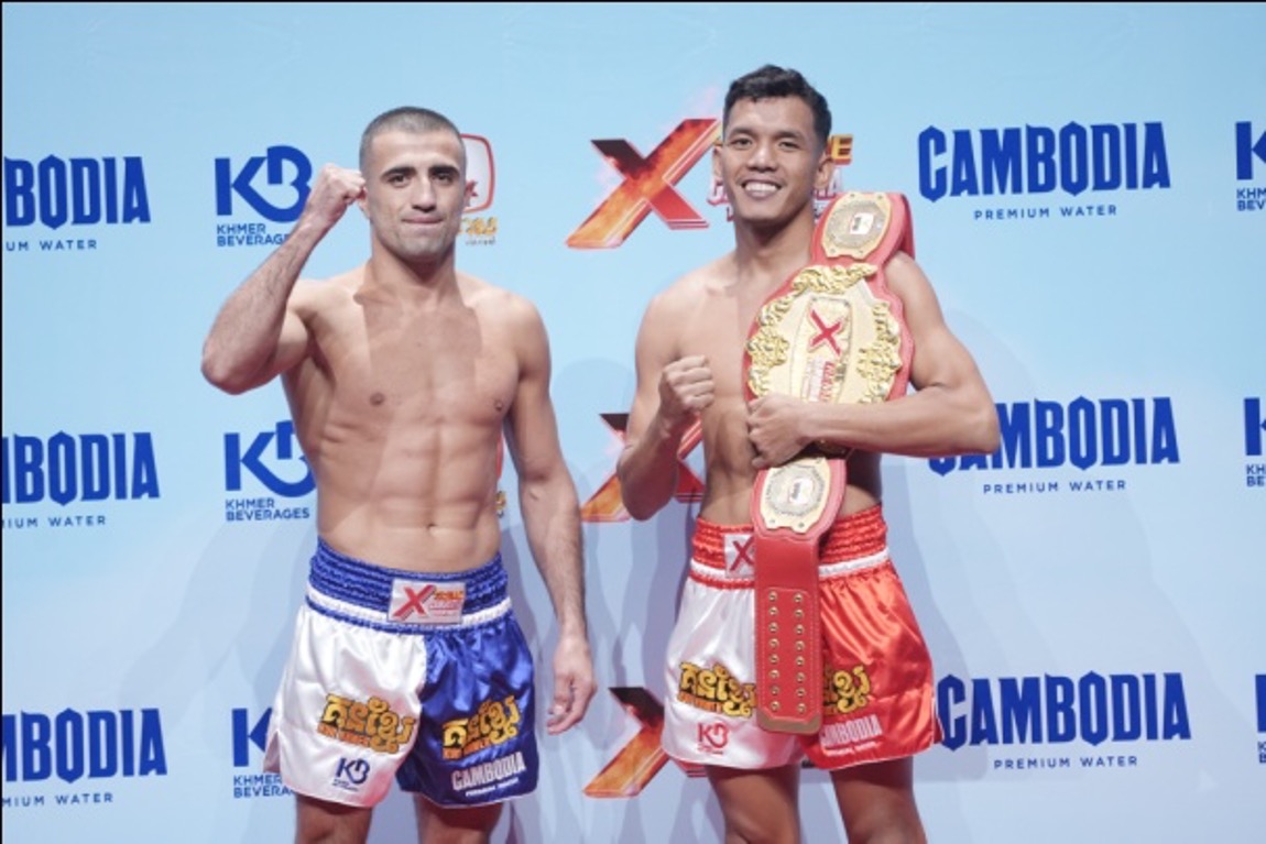 Local hero Bird Songkherm shows his 59kg belt ahead of his bout with Russian Aslanbek Zikreev. Heng Meas
