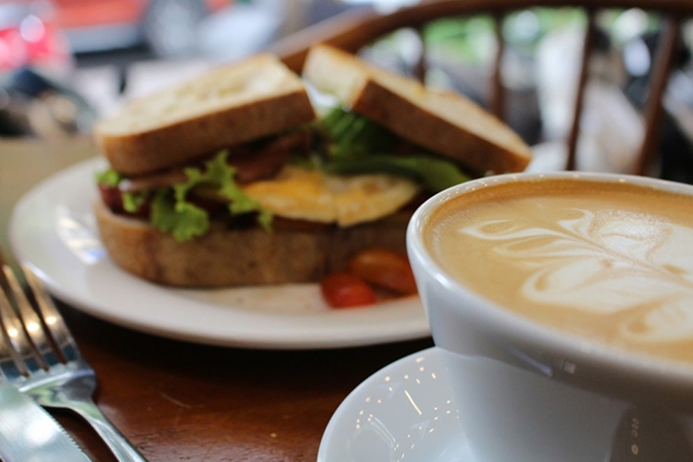 A western touch with a sandwich and local coffee at the Melbourne Cafe in HCM City. PHOTO: VIETNAM NEWS