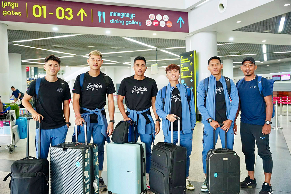 Members of the Cambodian national team arrive at Phnom Penh International Airport on Monday. FFC