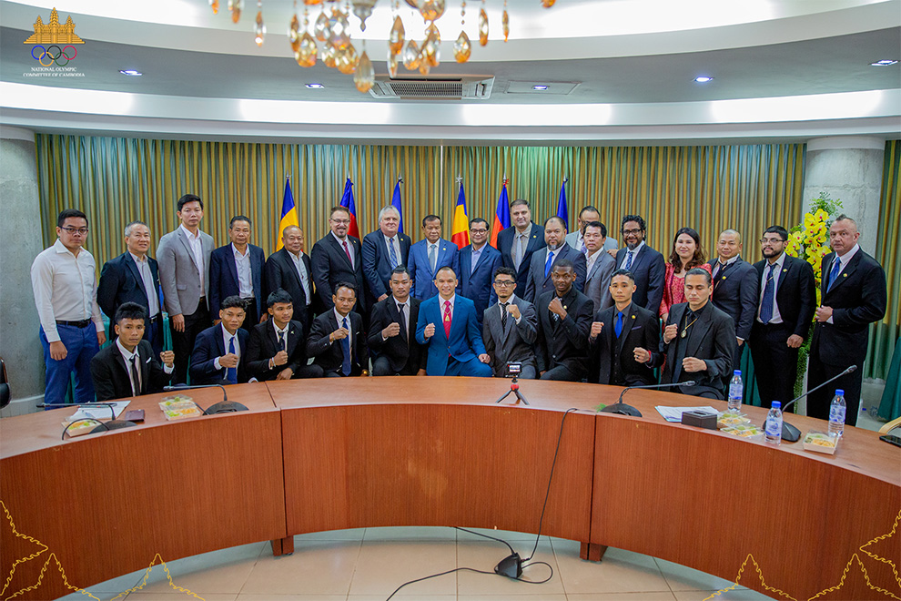 The Kun Khmer and US kickboxing delegations also paid a courtesy call on NOCC president Thong Khon (centre, rear) at NOCC headquarters on March 25. NOCC