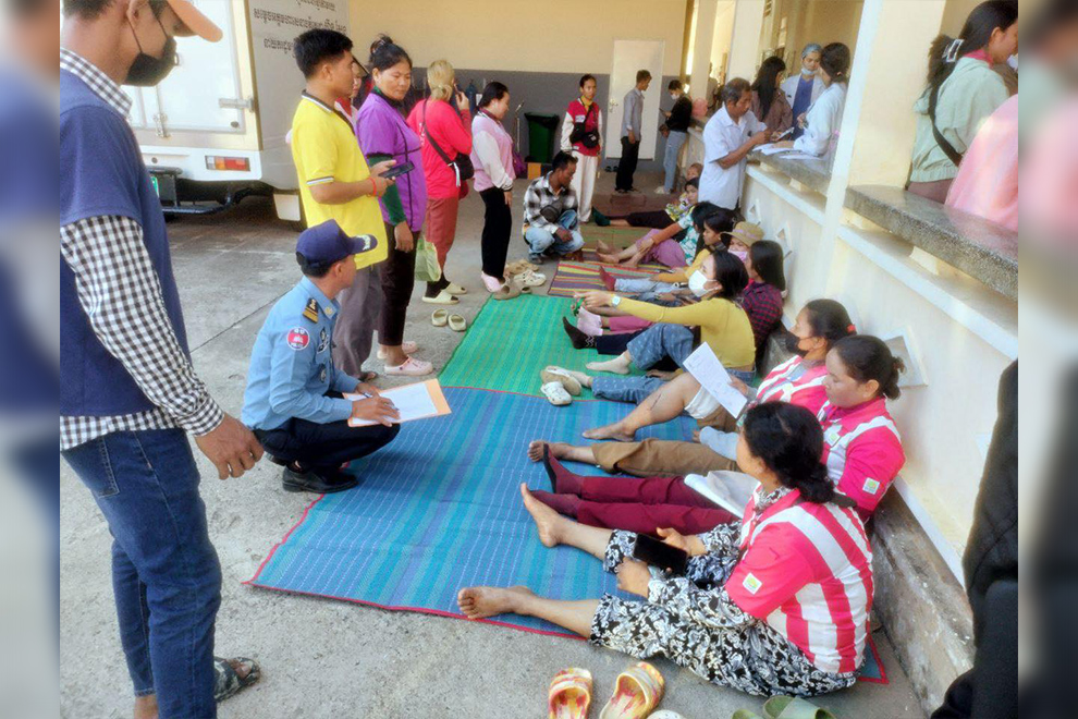 The distraught passengers receive assistance from the authorities. Kampong Speu police