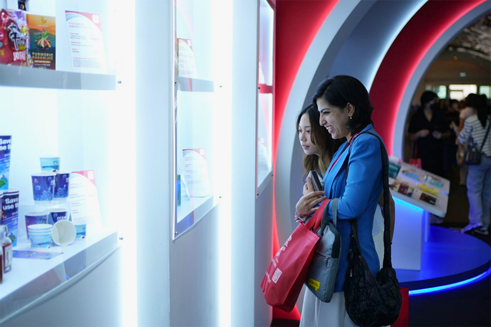 Visitors examine the top food products and solutions that were selected for this exclusive show. Supplied