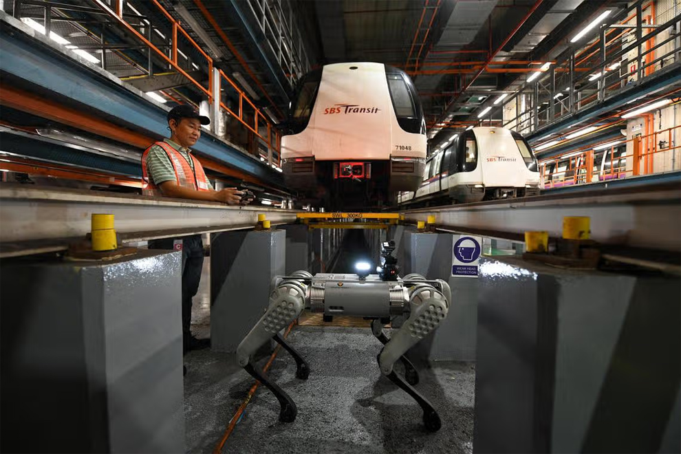 SBS Transit’s robotic dog, which can detect anomalies on a train’s underframe, such as missing component parts, was showcased at the Sengkang Depot on May 24, 2023. PHOTO: THE STRAITS TIMES
