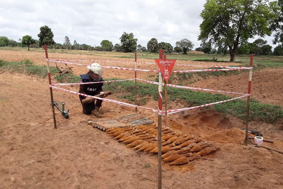 The munitions were discovered buried in two pits, after a farmer unearthed a rocket while ploughing his field. CMAC