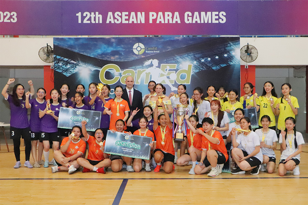 The four winning teams pose with their coaches at the closing ceremony of the 2025 CamEd Women’s Futsal Tournament. Supplied
