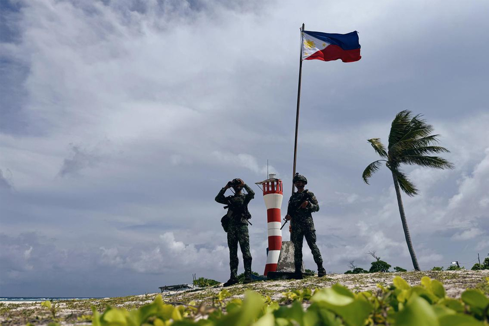 Filipino troops standing guard at West York Island, one of the Philippine-occupied features in the disputed South China Sea, on June 5. PHOTO: THE STRAITS TIMES