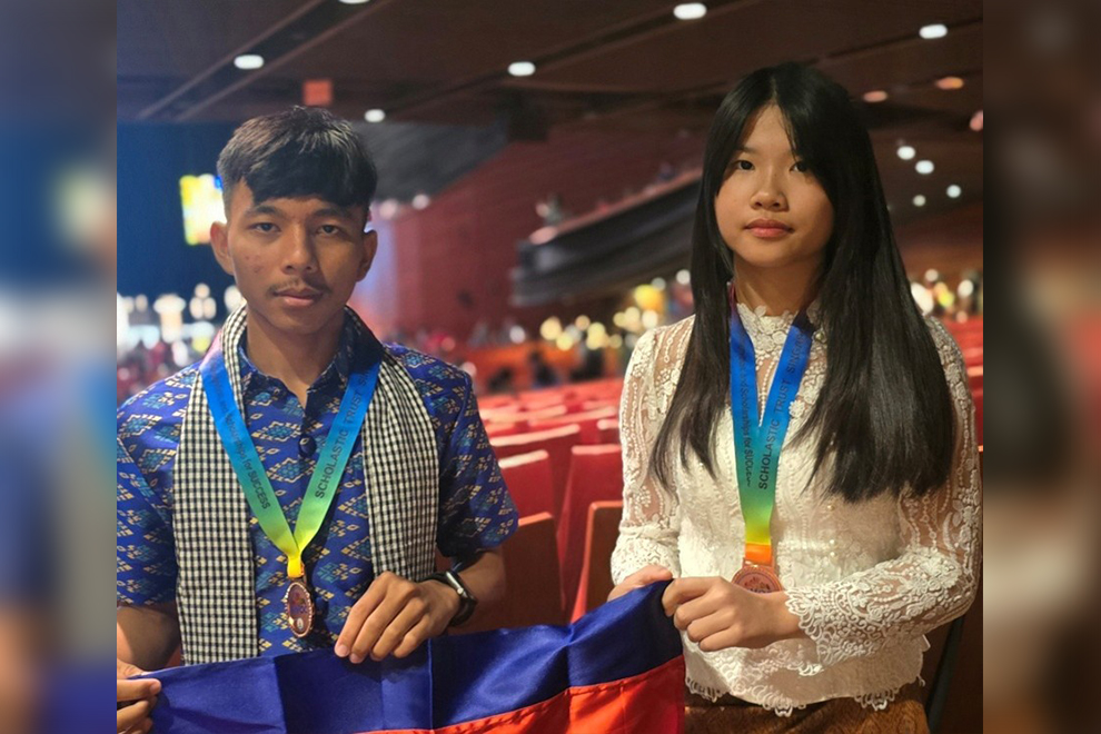 Kheangsophany P. Spring, cheered by her parents and grandmother, received a bronze medal at SIMOC, held in Singapore from July 5–9, 2025. Supplied