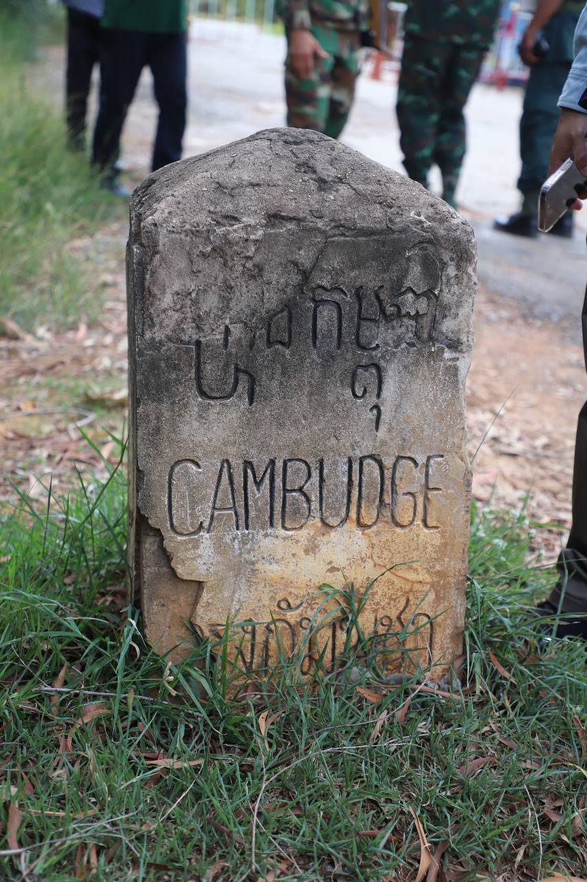 A colonial road marker indicates Cambodian territory. Supplied