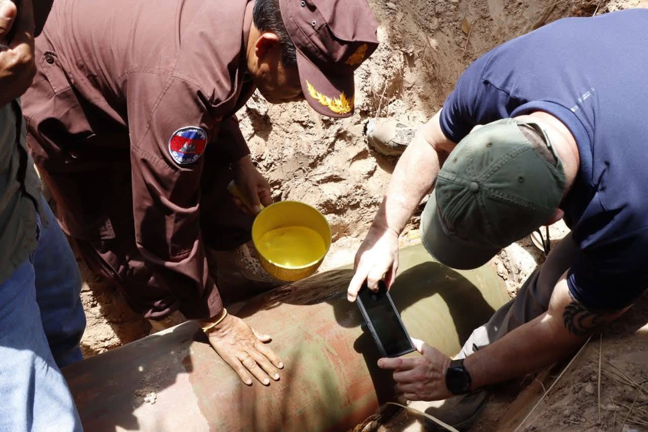 A CMAC operator carries out search and clearance tasks to ensure safety at the site of a landmine explosion in the O'Smach area of Oddar Meanchey province on June 16. CMAC