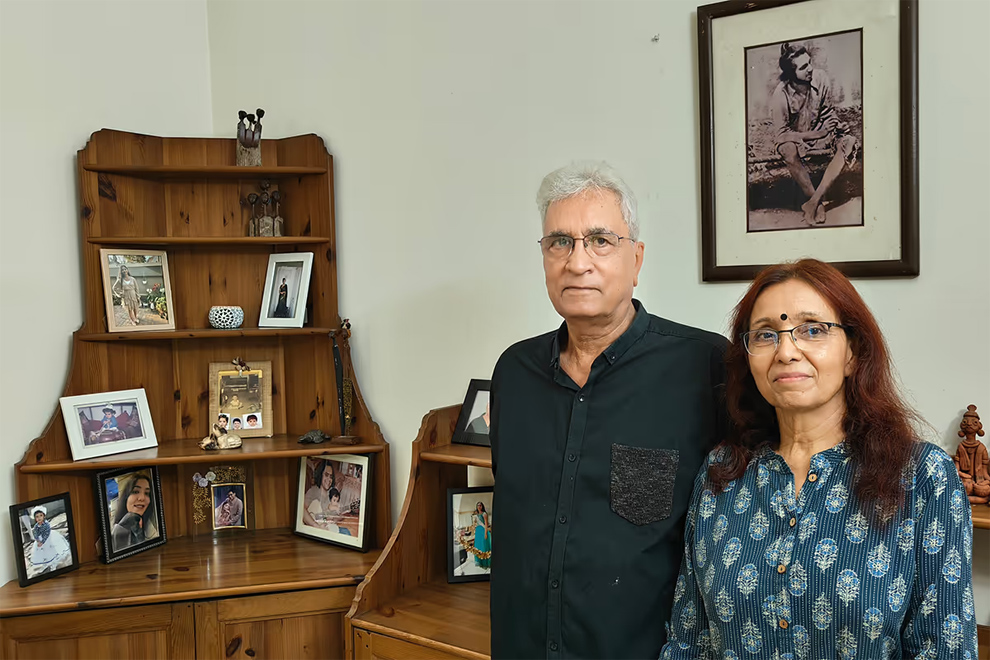 Dr Islam with his wife, Ms Neelima Sharma, in their house in Gurugram. Hanging on the wall behind them is a framed photo of their idol – Indian freedom fighter and passionate social justice advocate Bhagat Singh. ST PHOTO: DEBARSHI DASGUPTA