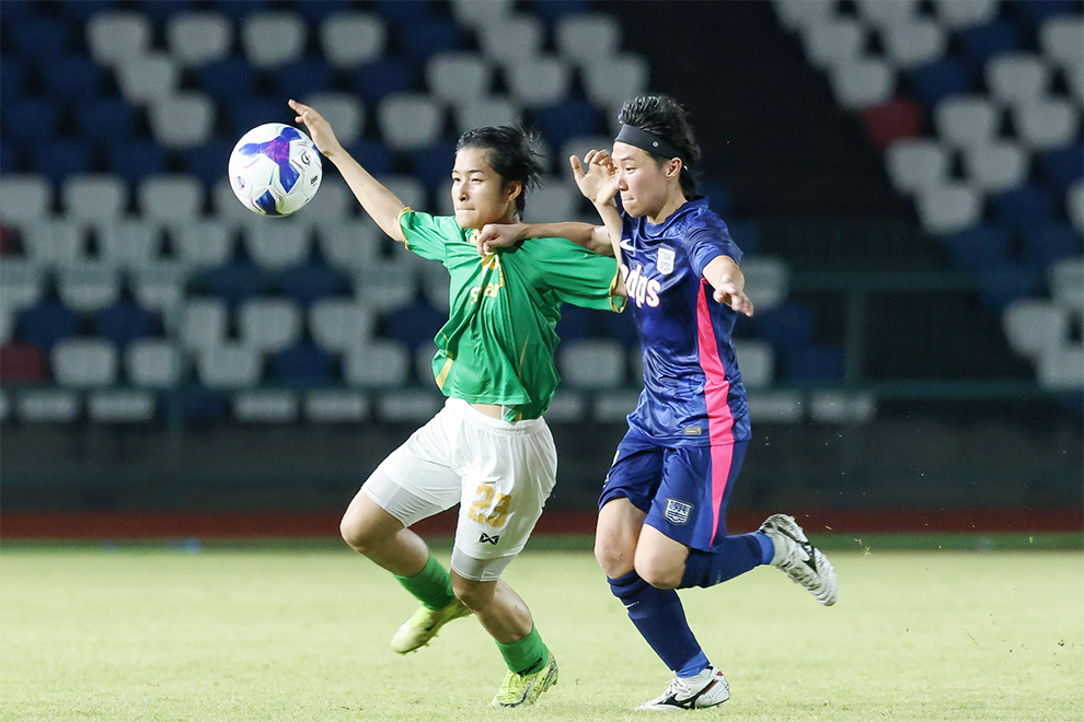 Defender Somrith Nimol challenges a Kitchee player for the ball. CPL