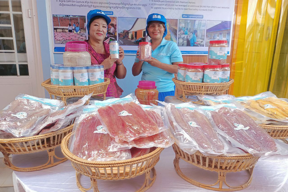 Touch Prov (left), the owner of the business, targets low- to mid-level consumers, as well as Cambodians living abroad. Phak Seangly