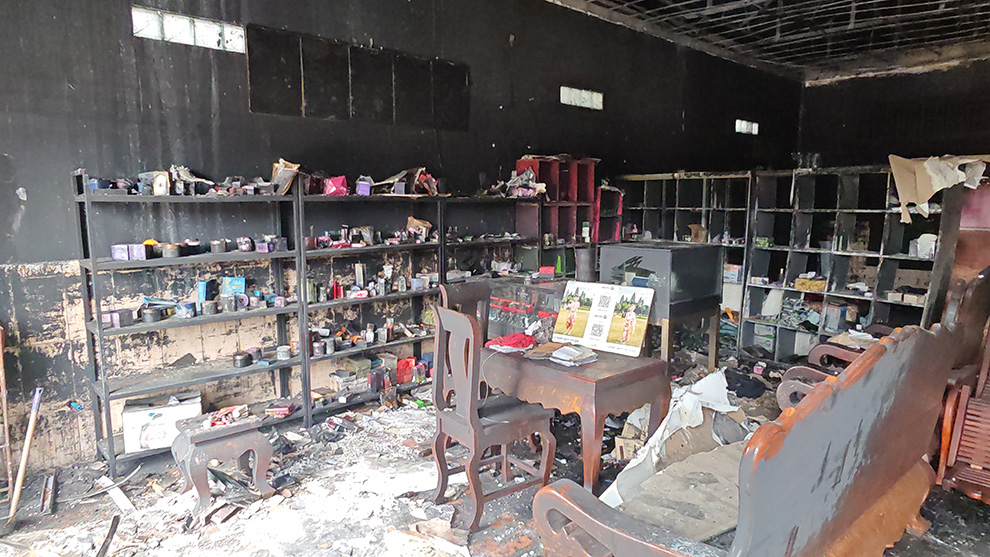 “Night falls on six Cambodian homes which are surrounded by Thai razor wire in Prey Chan village, Banteay Meanchey province. Hong Raksmey