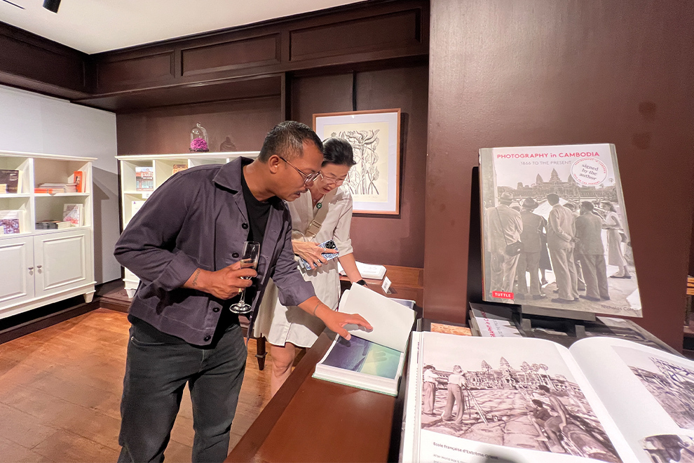 Guests examine some of the rare editions which are on display at the The Gallery in Sofitel Phnom Penh Phokeethra. Supplied
