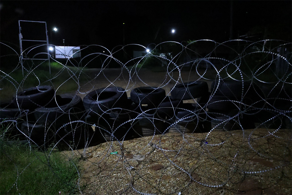 Loudspeakers behind a razor wire barricade in O Beichoan commune, Banteay Meanchey province. Supplied