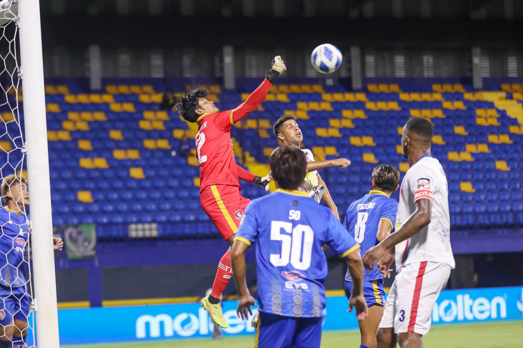 Royal Cambodian Armed Forces FC goalkeeper Um Sereyroth punches the ball away, during an earlier Cambodian Premier League (CPL) match. Army FC
