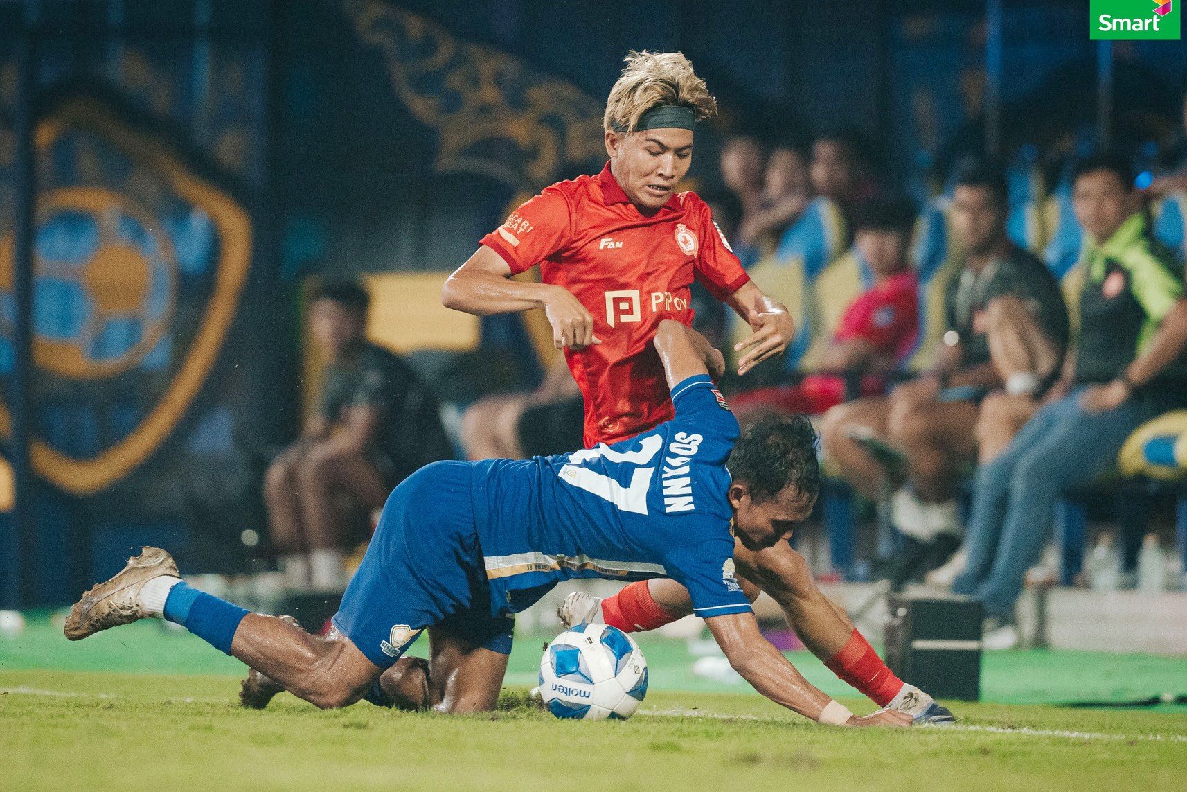 Ouk Sovann of Visakha falls during the match against Phnom Penh Crown — he scored the equalizer in the 73rd minute after Moses Dyer had given Crown the lead in the 57th minute.
