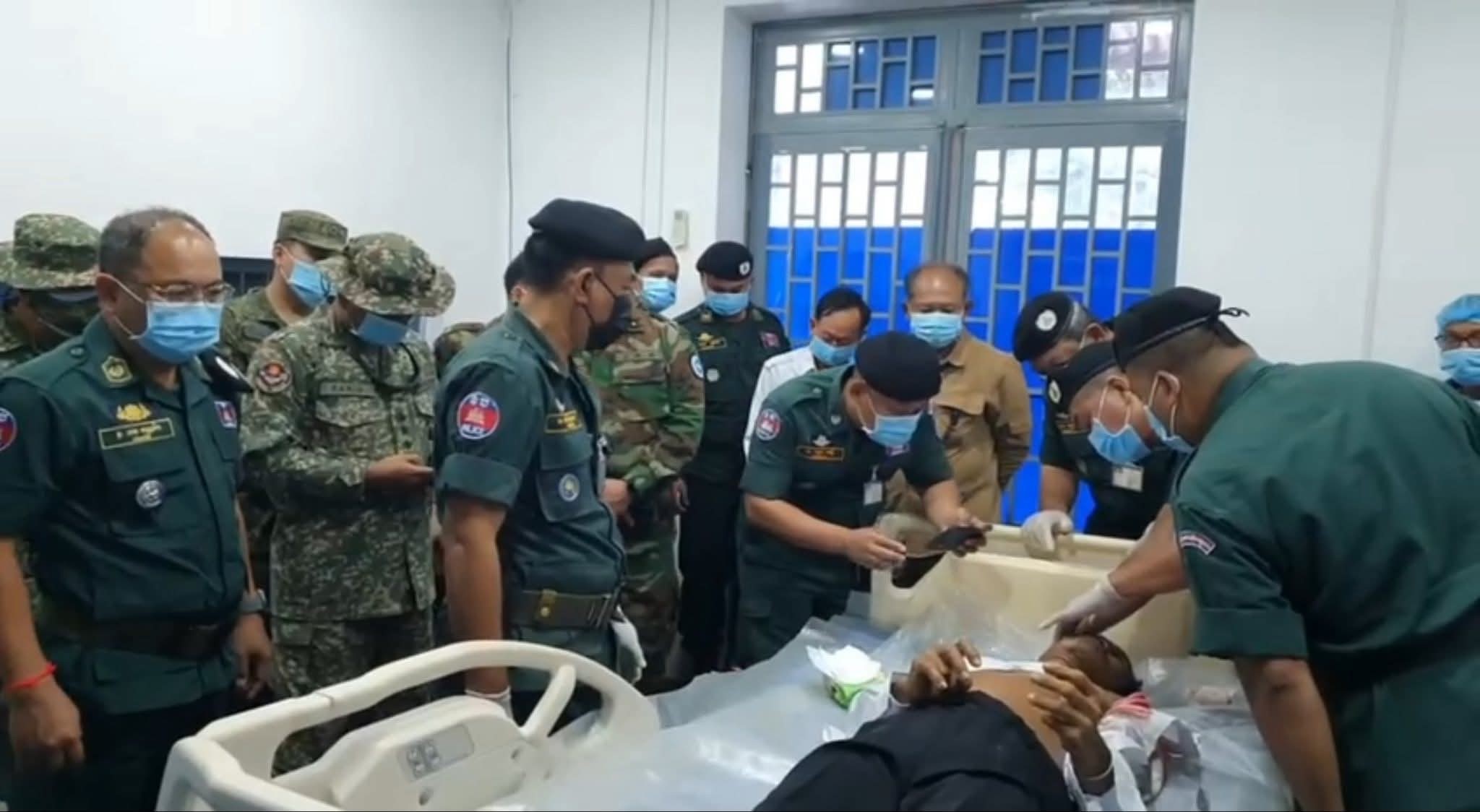 Cambodian forensic officials examine the body of Dy Nai during a surgical procedure witnessed by the ASEAN Observation Team. Supplied